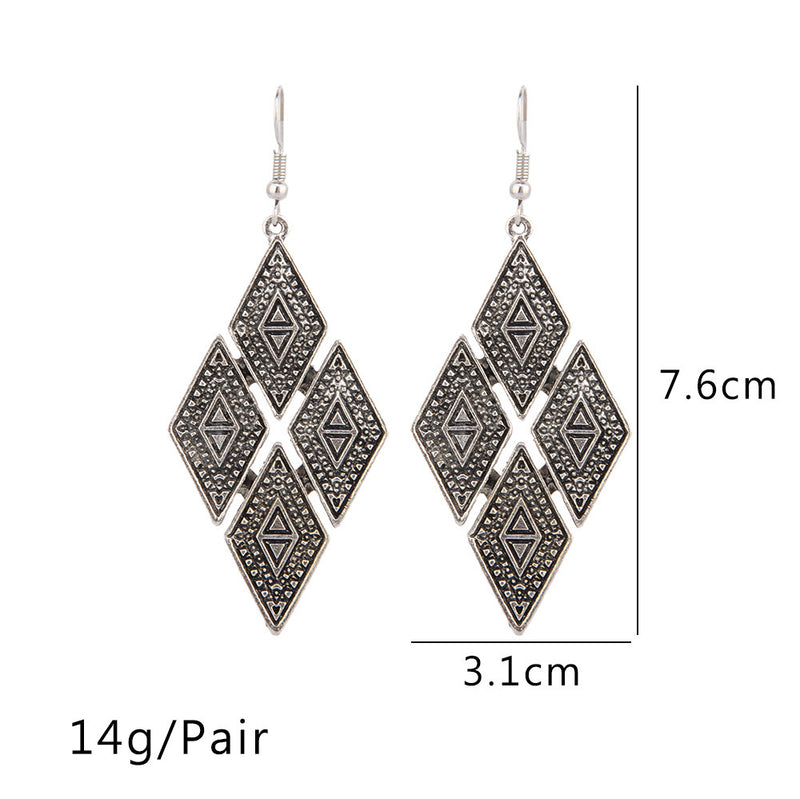 Exaggerated geometric diamond carved earrings