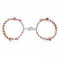 Holding Magnets To Attract Christmas Couple Bracelets