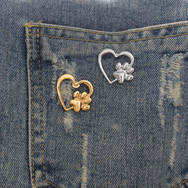 Caring dog paw cutout brooch