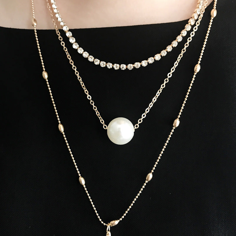 Europe and the United States new clavicle neck chain women's suit claw chain crystal pendant three-layer pearl necklace women's jewelry wholesale