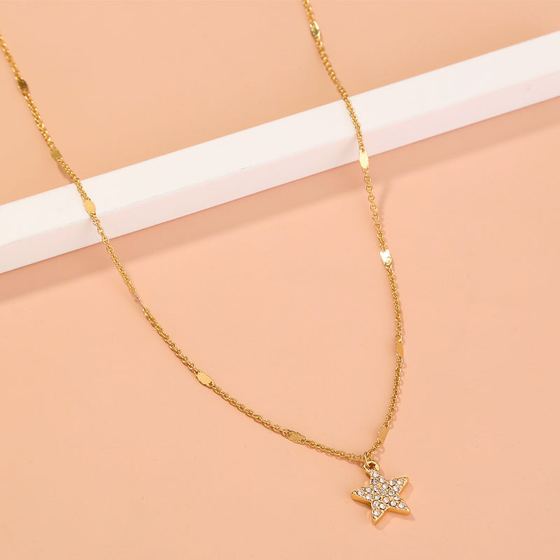 A diamond-encrusted Pentagram geometric clavicle necklace