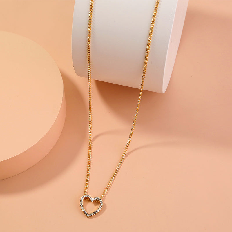A Diamond Necklace With A Hollow Heart