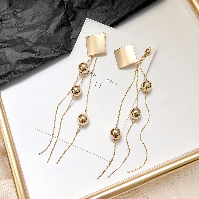 Long fringe exaggerated earrings