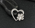 Caring dog paw cutout brooch