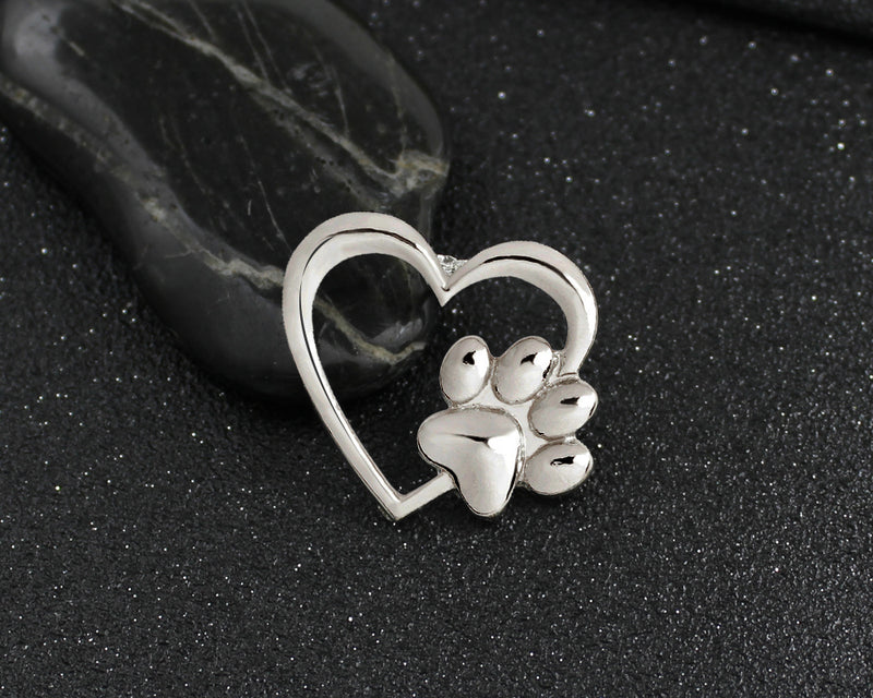 Caring dog paw cutout brooch