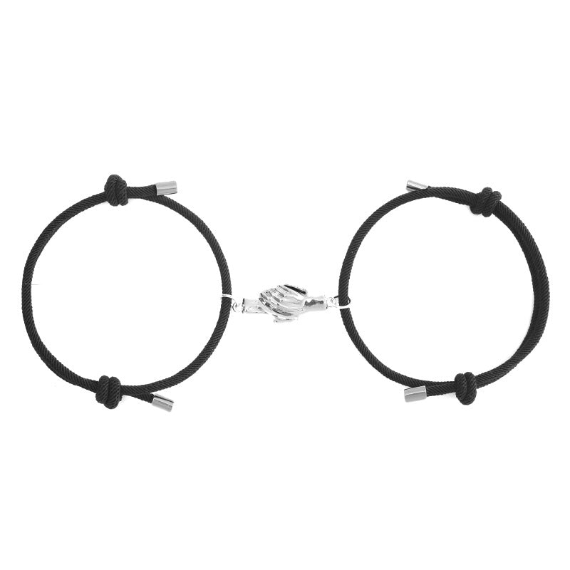 Holding Magnets To Attract Christmas Couple Bracelets