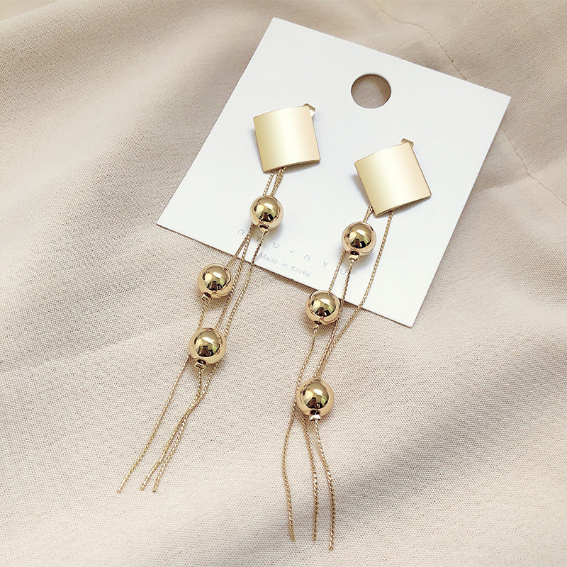 Long fringe exaggerated earrings