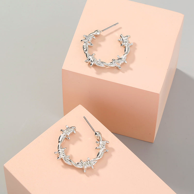 European and American foreign trade ins accessories fashion street trend cold wind metal texture knotted thorn C-shaped earrings