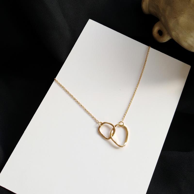 Double ring interlocking pendant