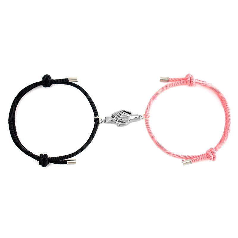 Holding Magnets To Attract Christmas Couple Bracelets