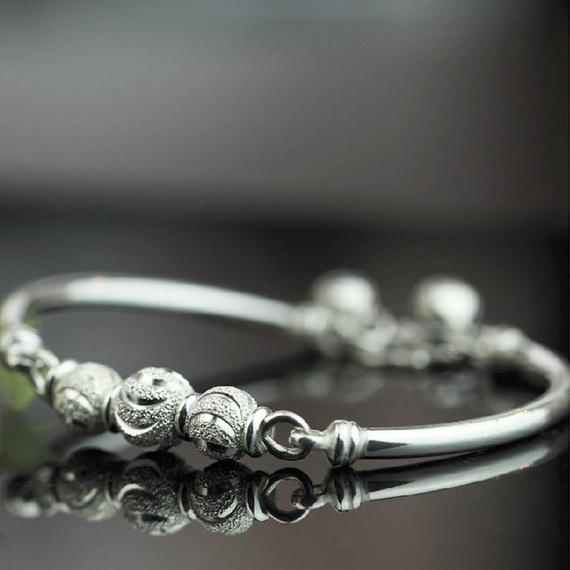 Turning Beads and Bells Silver Plated Bracelet